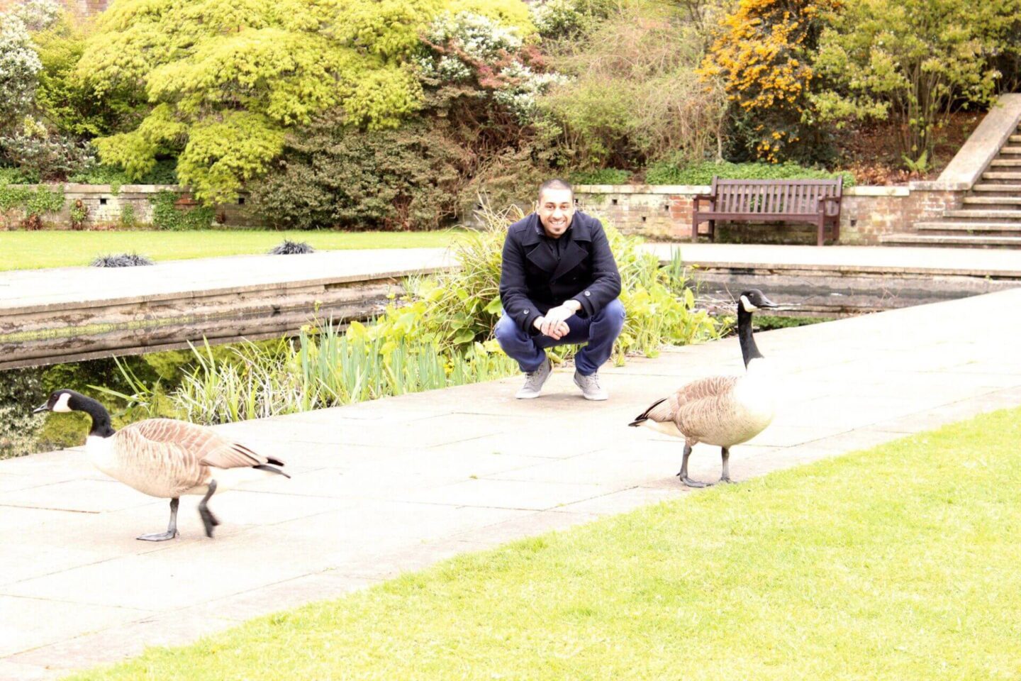 man posing with 2 ducks
