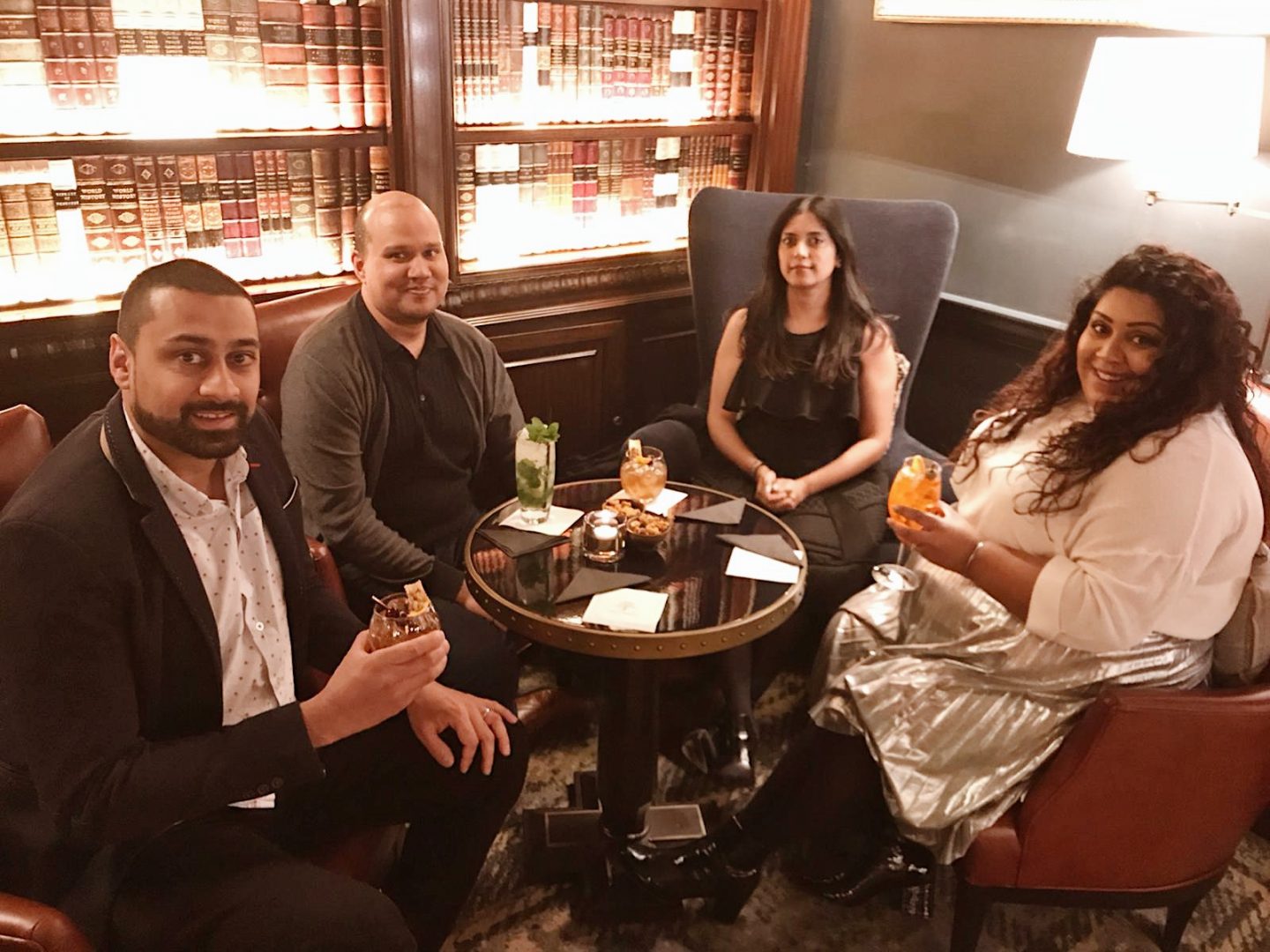 Afternoon Tea, Cocktails & A Tour Of The Langley Hotel Spa, Nishi V. Group of friends sat around a table holding cocktails