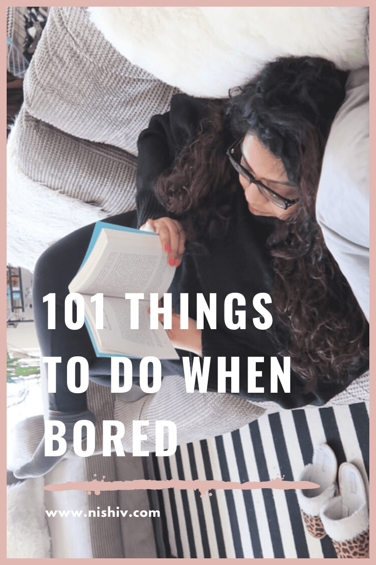 101 things to do in isolation, image of a woman lying on the sofa reading a book, nishi v