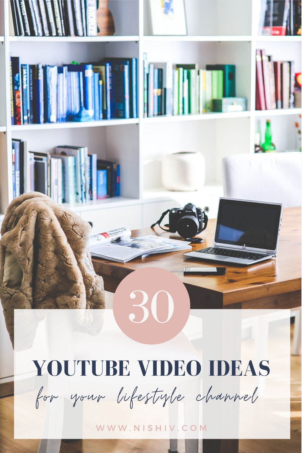 Pinterest image of work space with laptop and camera on table with colourful bookcases in background