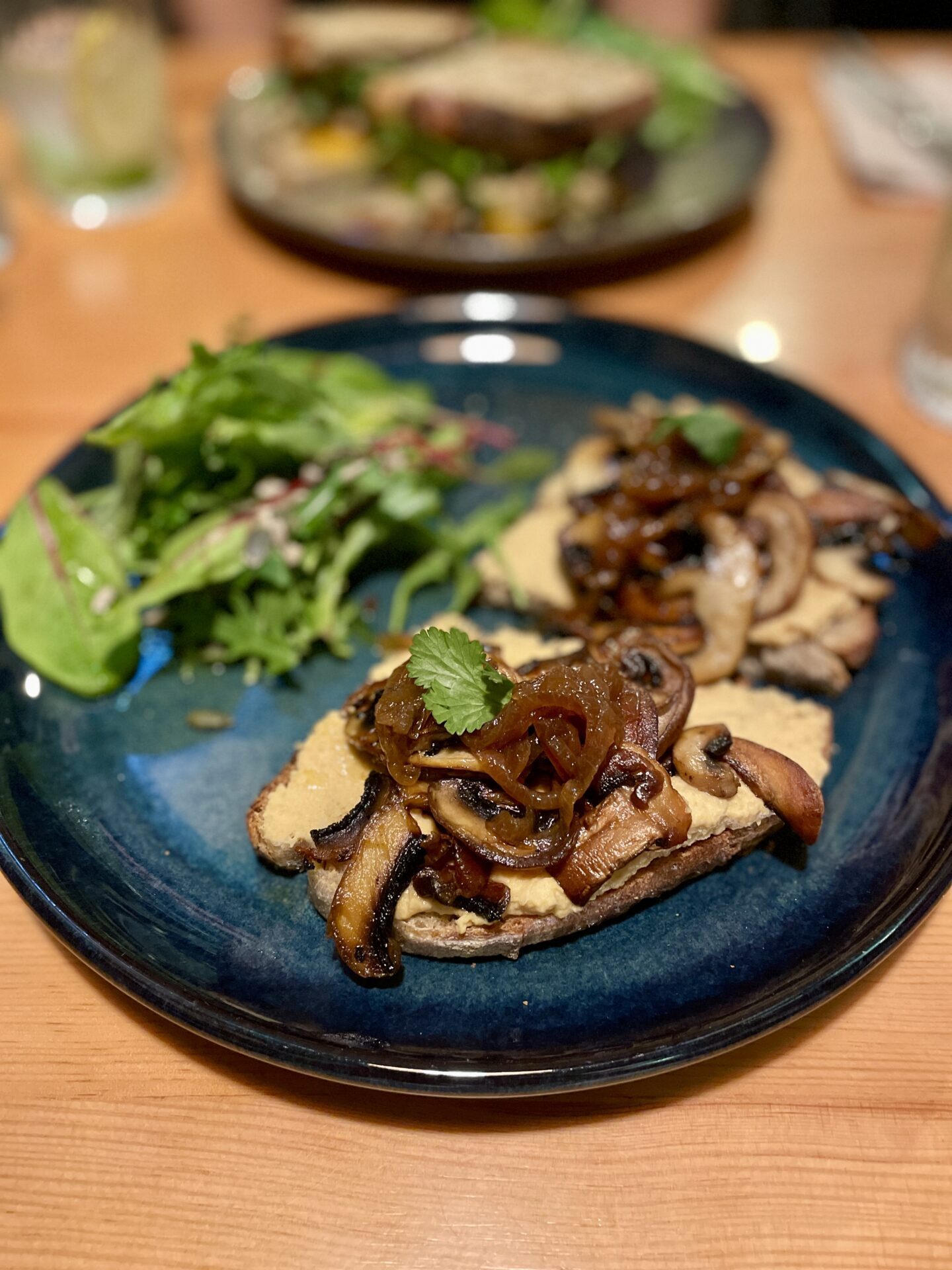 The Best Vegan and Vegetarian Restaurants In Porto, mushroom and hummus on toast at kind kitchen
