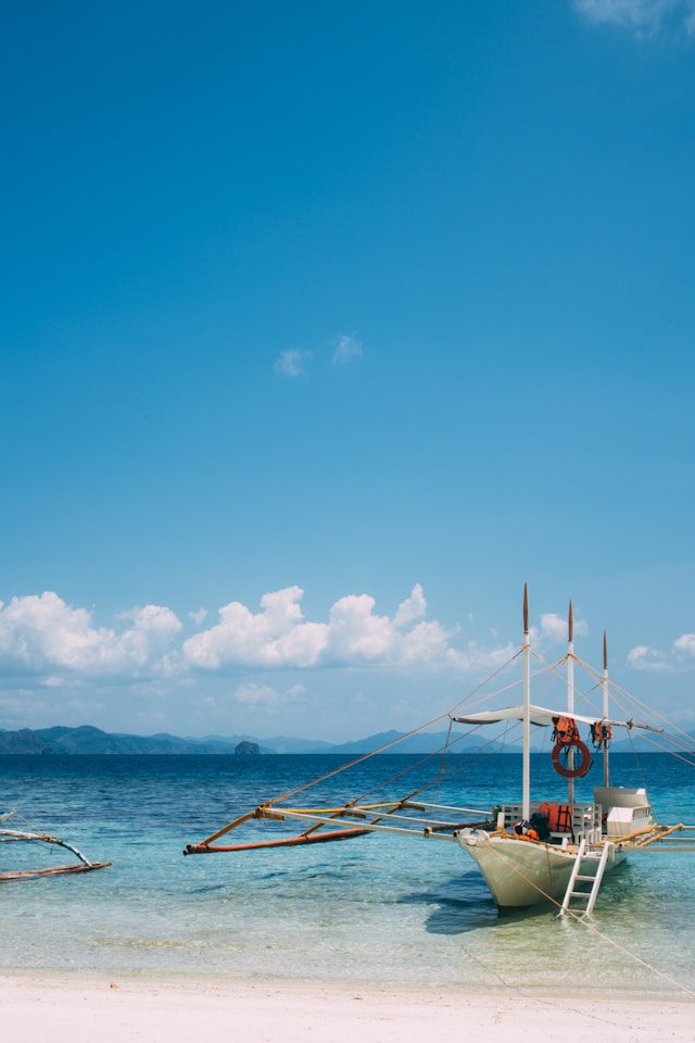 boat docked in el nido on an island hopping tour