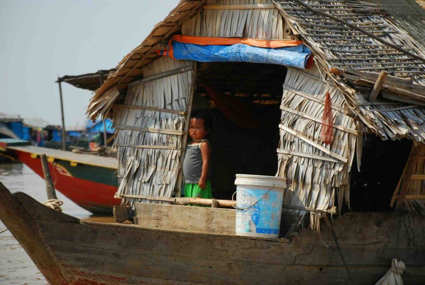 Child on a boat at the floating village on Tonle Sap lake