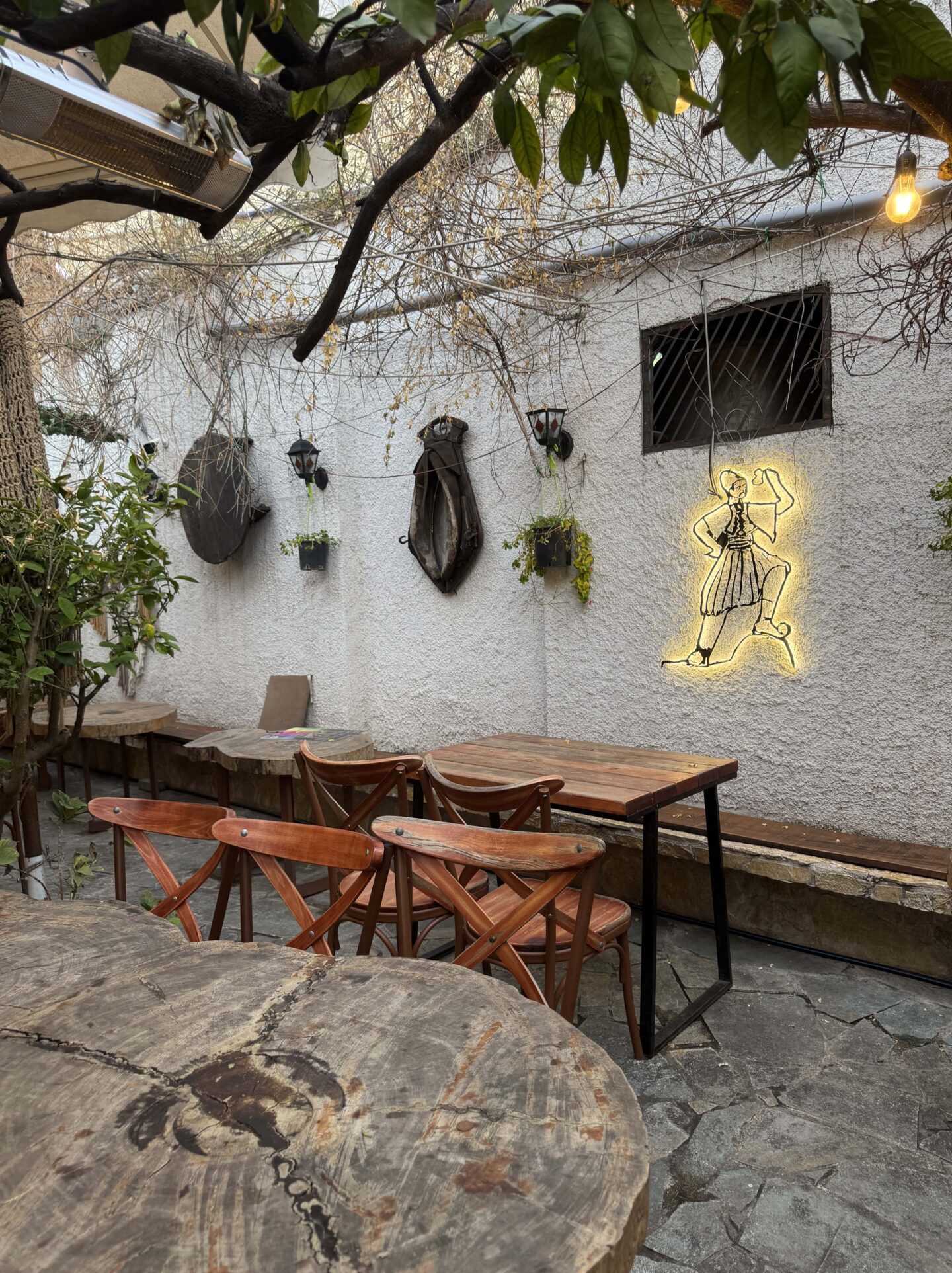 rustic Albanian seating outdoors at Oda Traditional Albanian Restaurant in Tirana