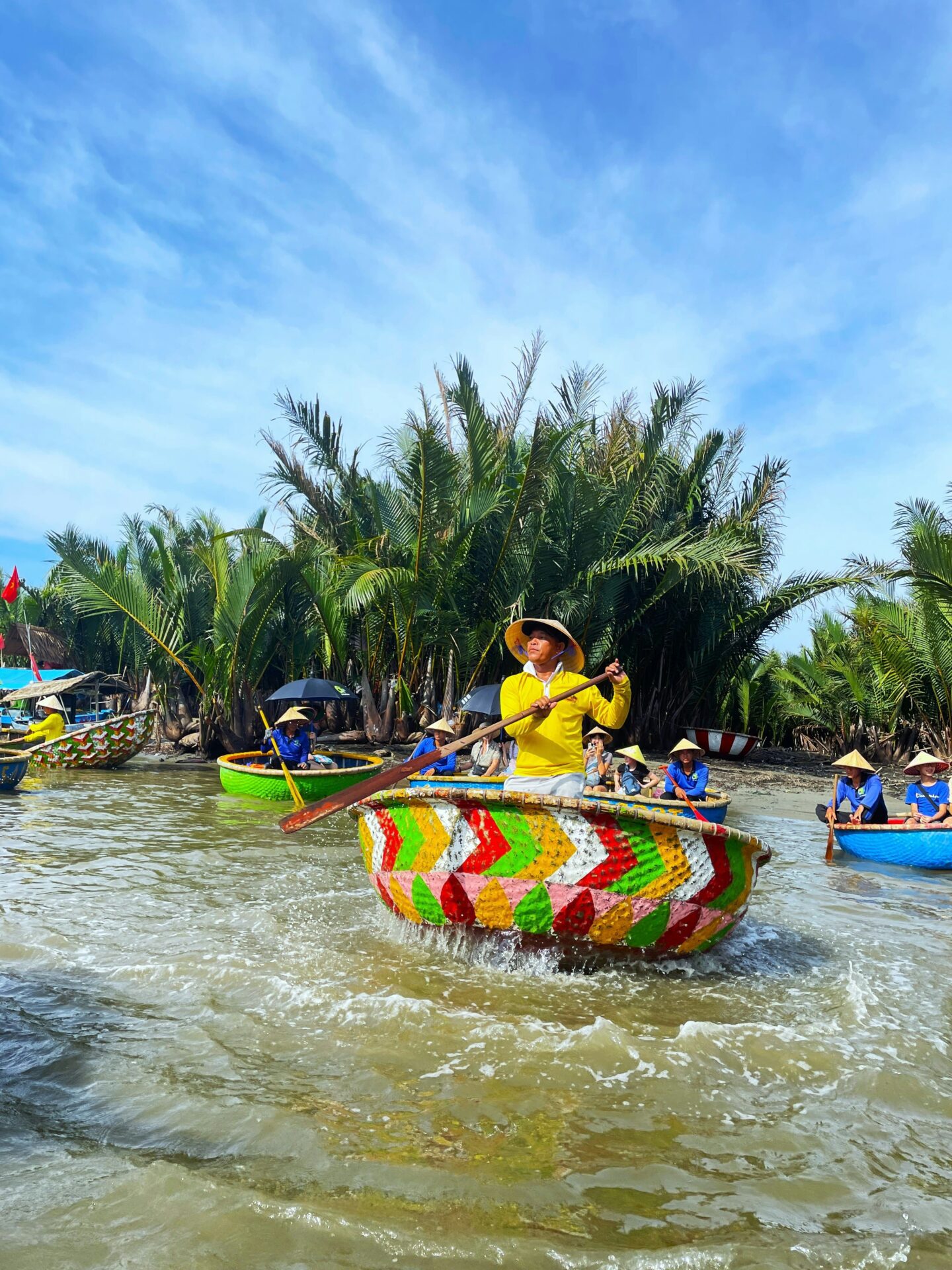 man on a coconut basket boat ride in Hoi An