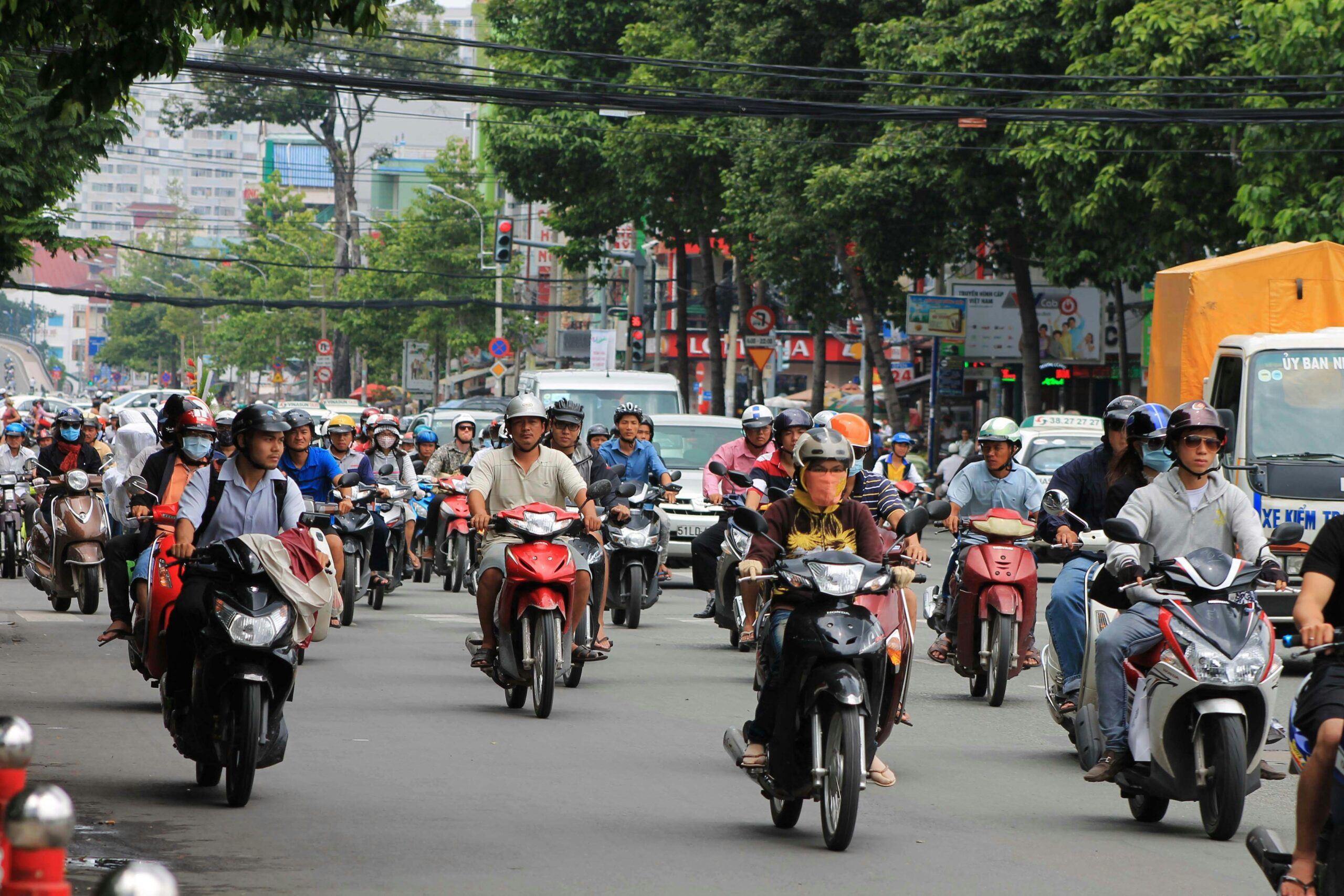 lots of motorbikes in ho chi minh city, photo taken from the middle of the road