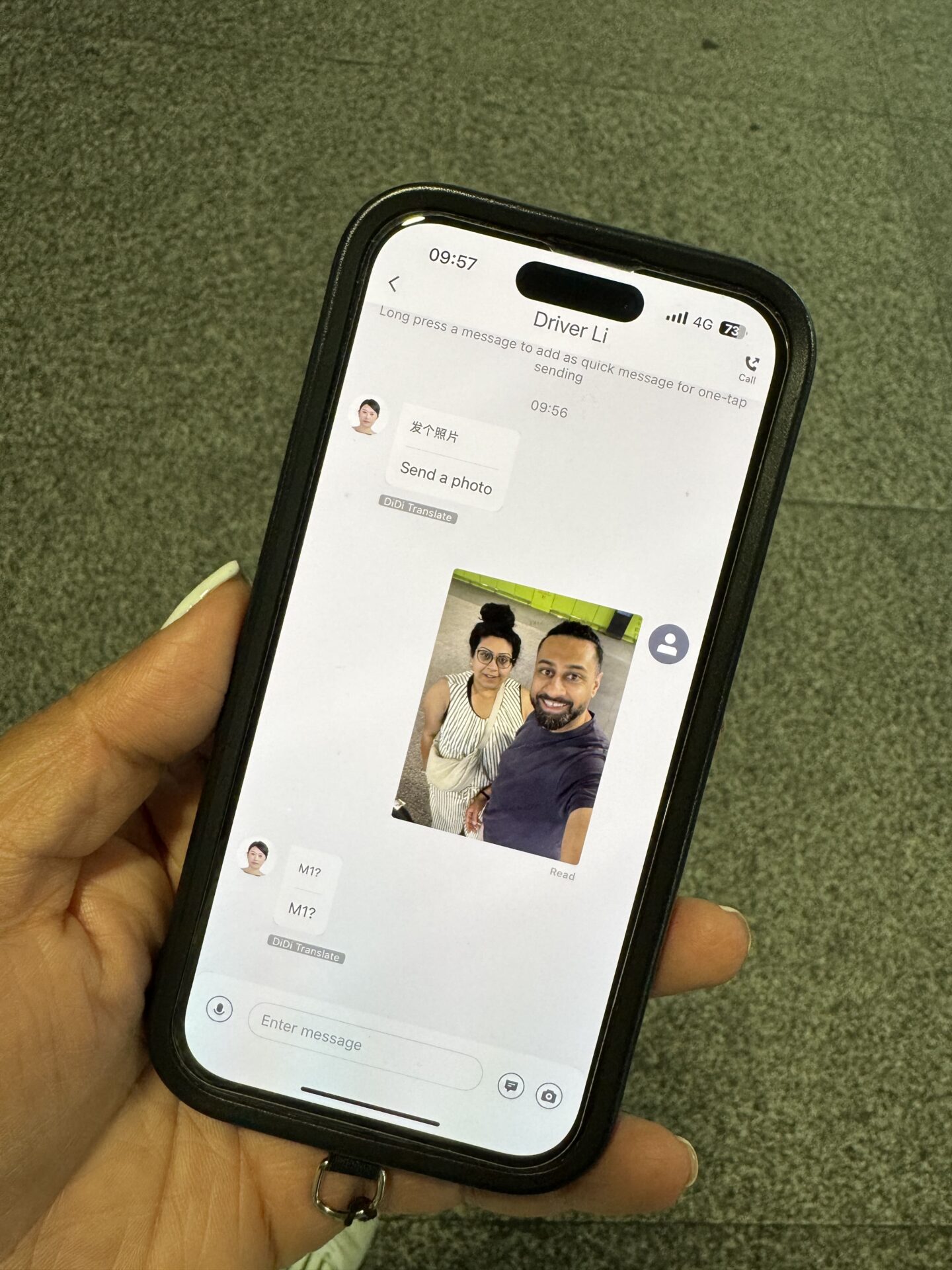 A photo of a phone with a conversation with a Didi driver in Shanghai asking for a selfie so they can locate us
