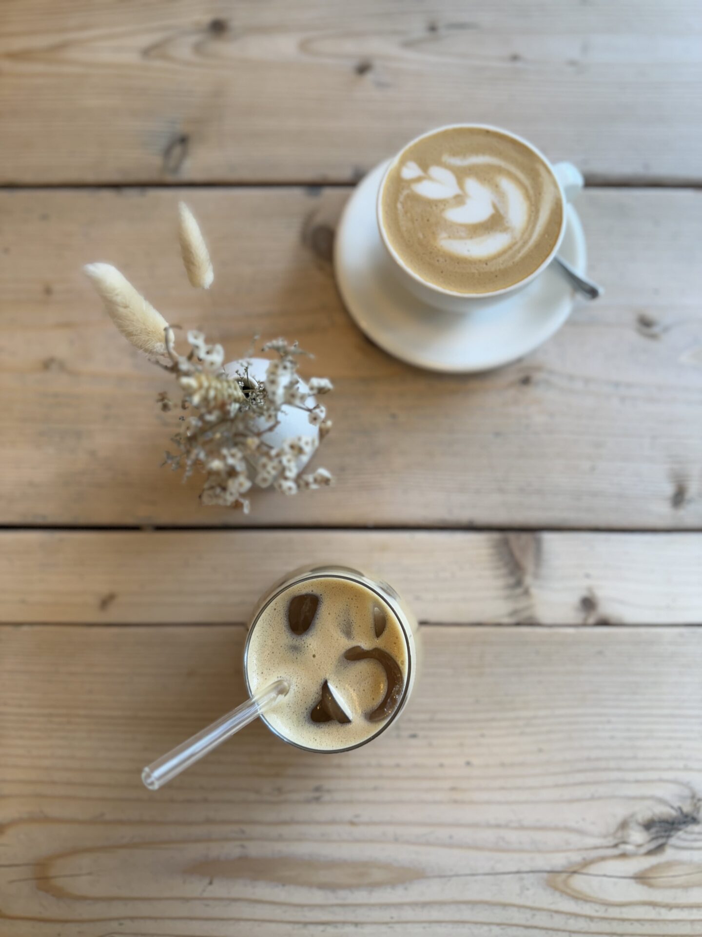 two coffees from a birdseye view on a wooden table at Jaunty Goat Chester
