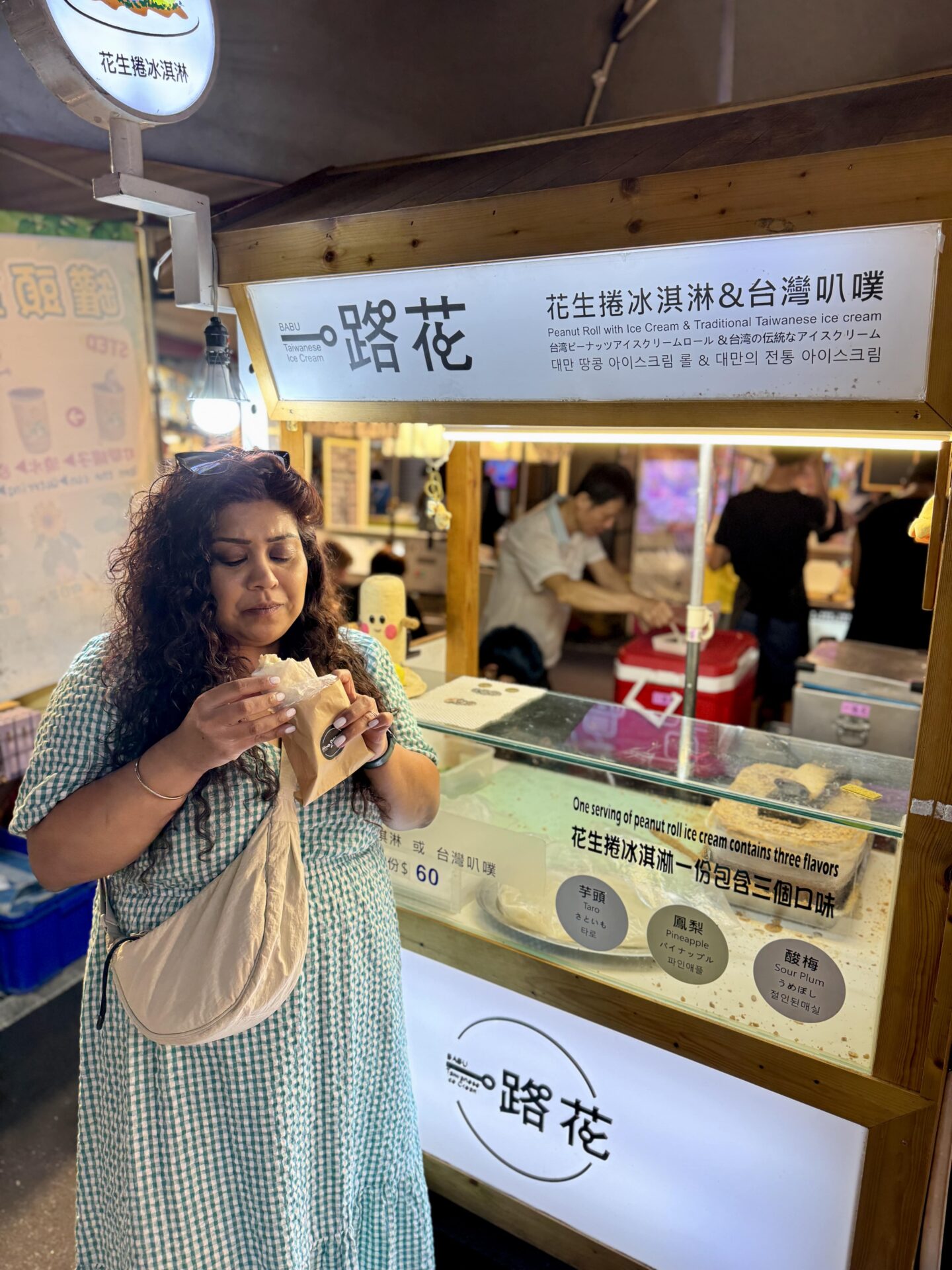 Nishi eating Taiwanese ice cream at Raohe Street Night Market in Taipei
