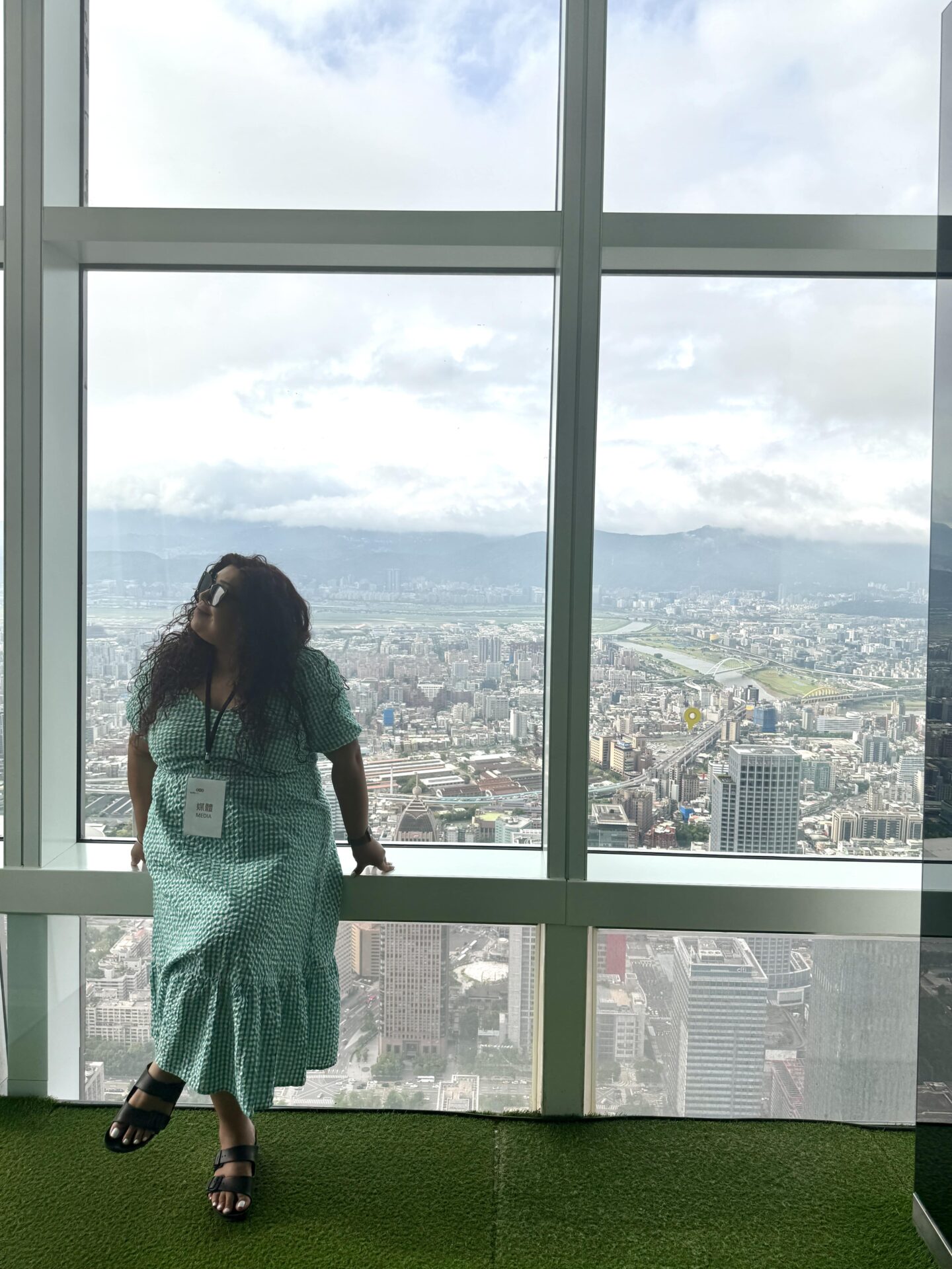 Nishi with the view from Taipei 101 behind her