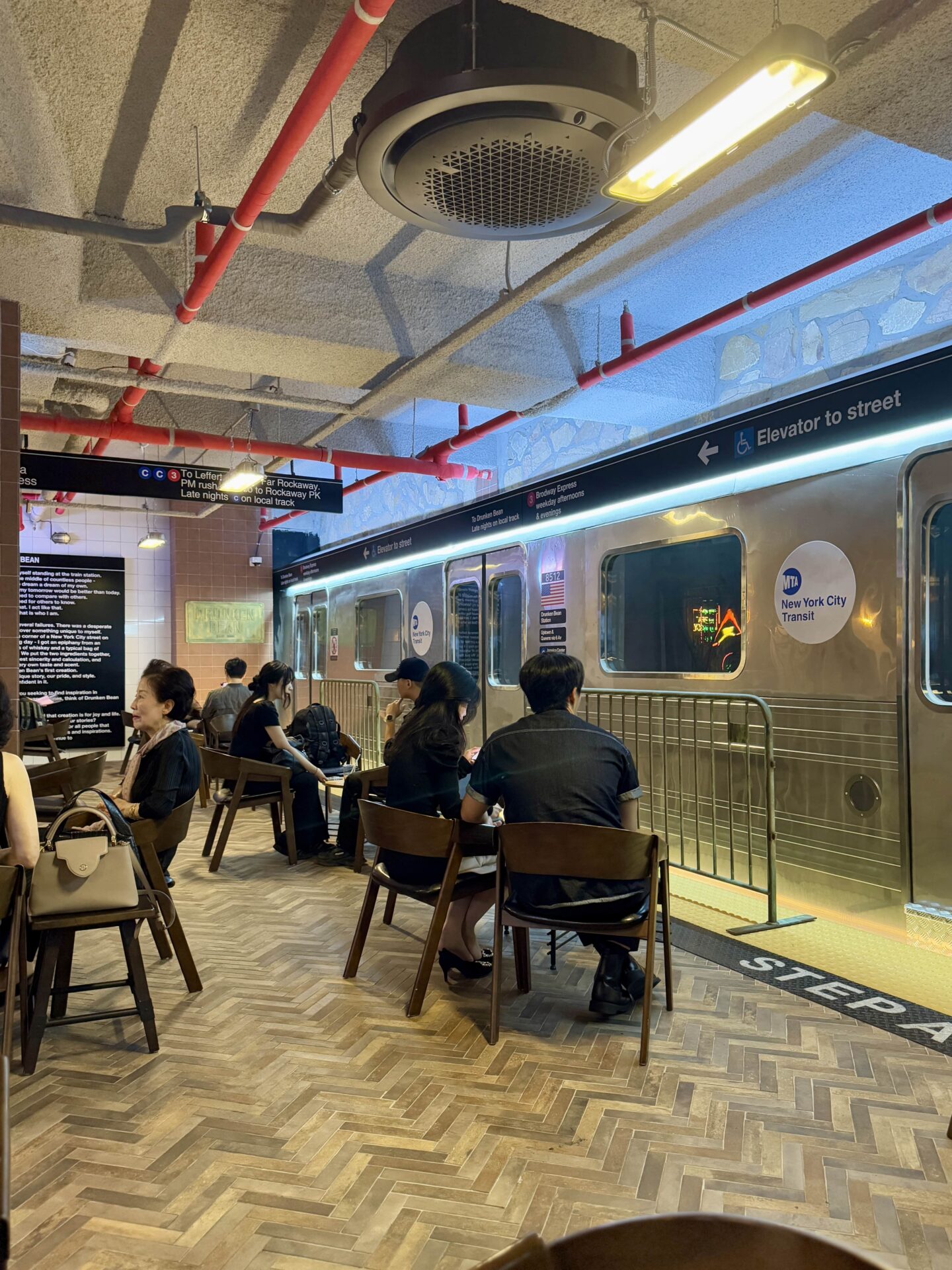 a replica NYC subway car inside Drunken Bean 드렁큰빈 - a New York subway themed cafe in Gangnam, Seoul